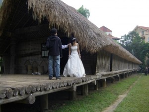 On the porch of a longhouse-- traditional home of a wealthy family