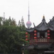 The Pearl of the Orient Tower as seen from the YuYuan Garden The Pearl of the Orient Tower as seen from the YuYuan Garden