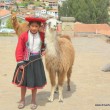 Girl with her pet, in Cusco, Peru Girl with her pet, in Cusco, Peru